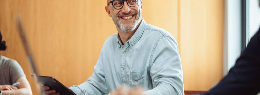 Man in blue shirt in meeting